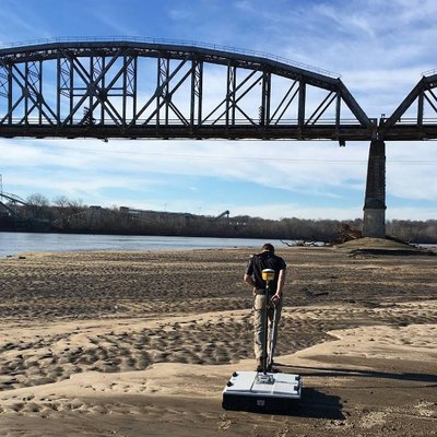 Performing a ground-penetrating radar survey of a sand bar downstream of the Sibley Railroad Bridge in Sibley, MO. Photo: Matt Art